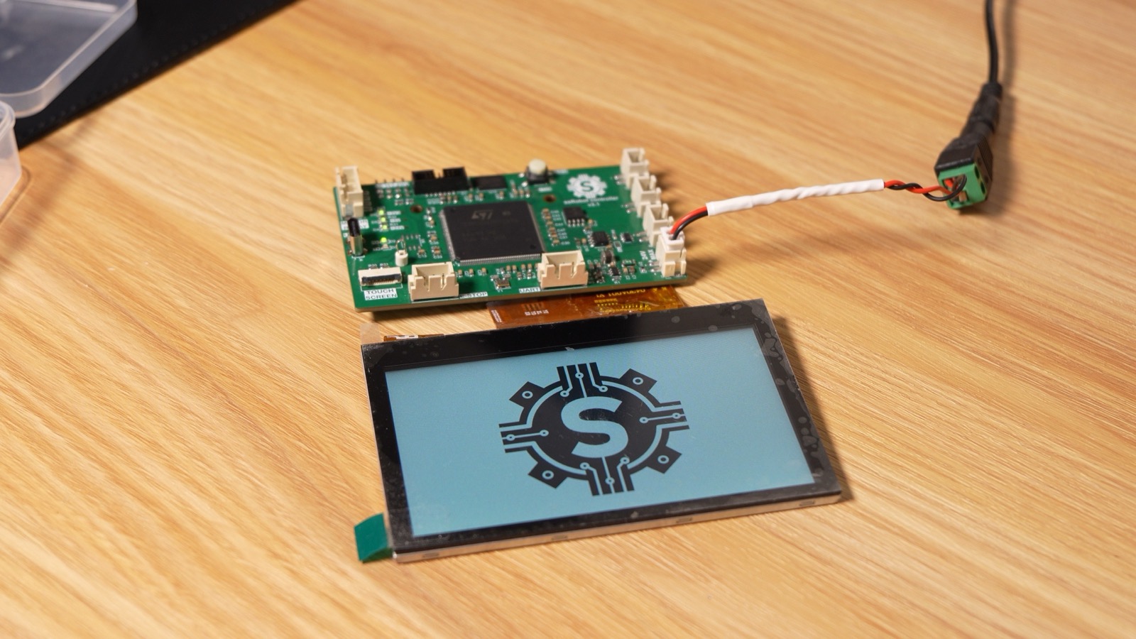 V3.1 robot controller driving the touchscreen, which shows the robot's logo