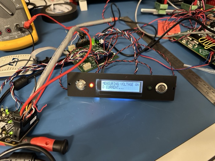Bench prototype of the LCD panel showing a voltage and current measurement