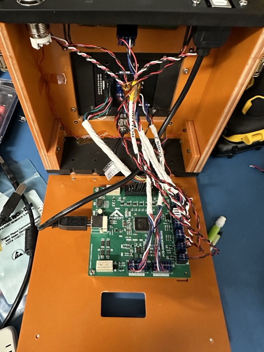 Fixture base opened up, showing the PCB and wiring