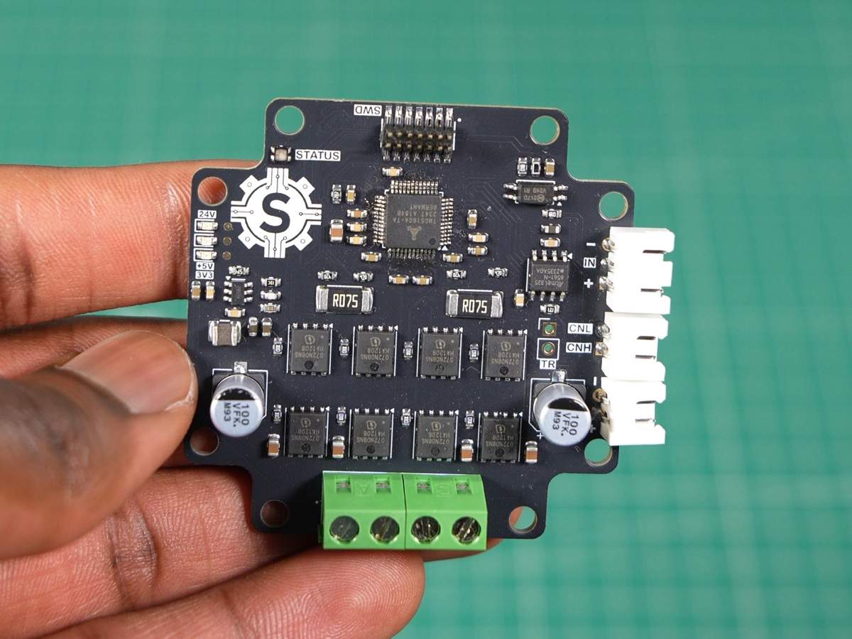 NEMA 23 driver board held in a hand